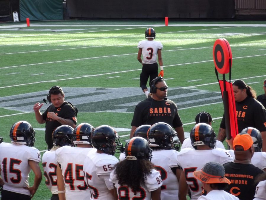 Campbell coaches briefing the team during half-time. Photo by Makena Pauly.