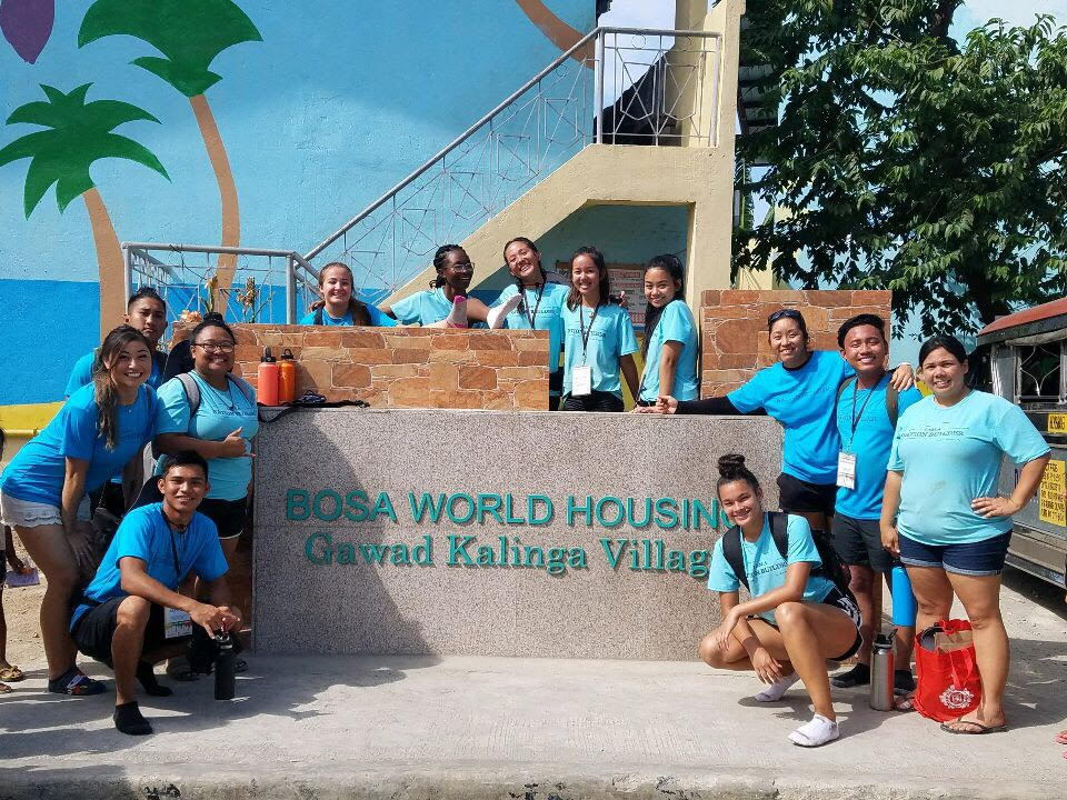 The JCHS Service Club posing with the “Gawad Kalinga” sign in the Philippines. Photo by JCHS Service Club.