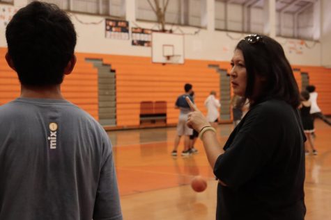 Lindsay Fassett speaks to one of her students during her P.E. class.