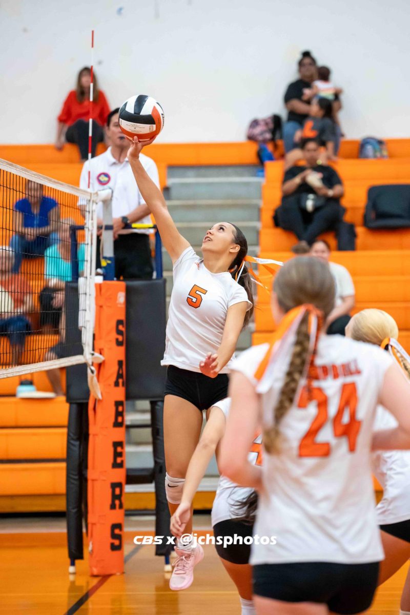 Sophomore Aleyah Tuitele, #5, on the Junior Varsity Volleyball Team helps her team rally against the Radford Rams.