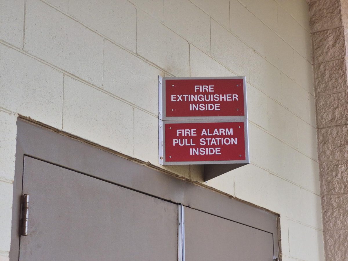 Emergency signs located outside of Saber Hall, James Campbell High School. 