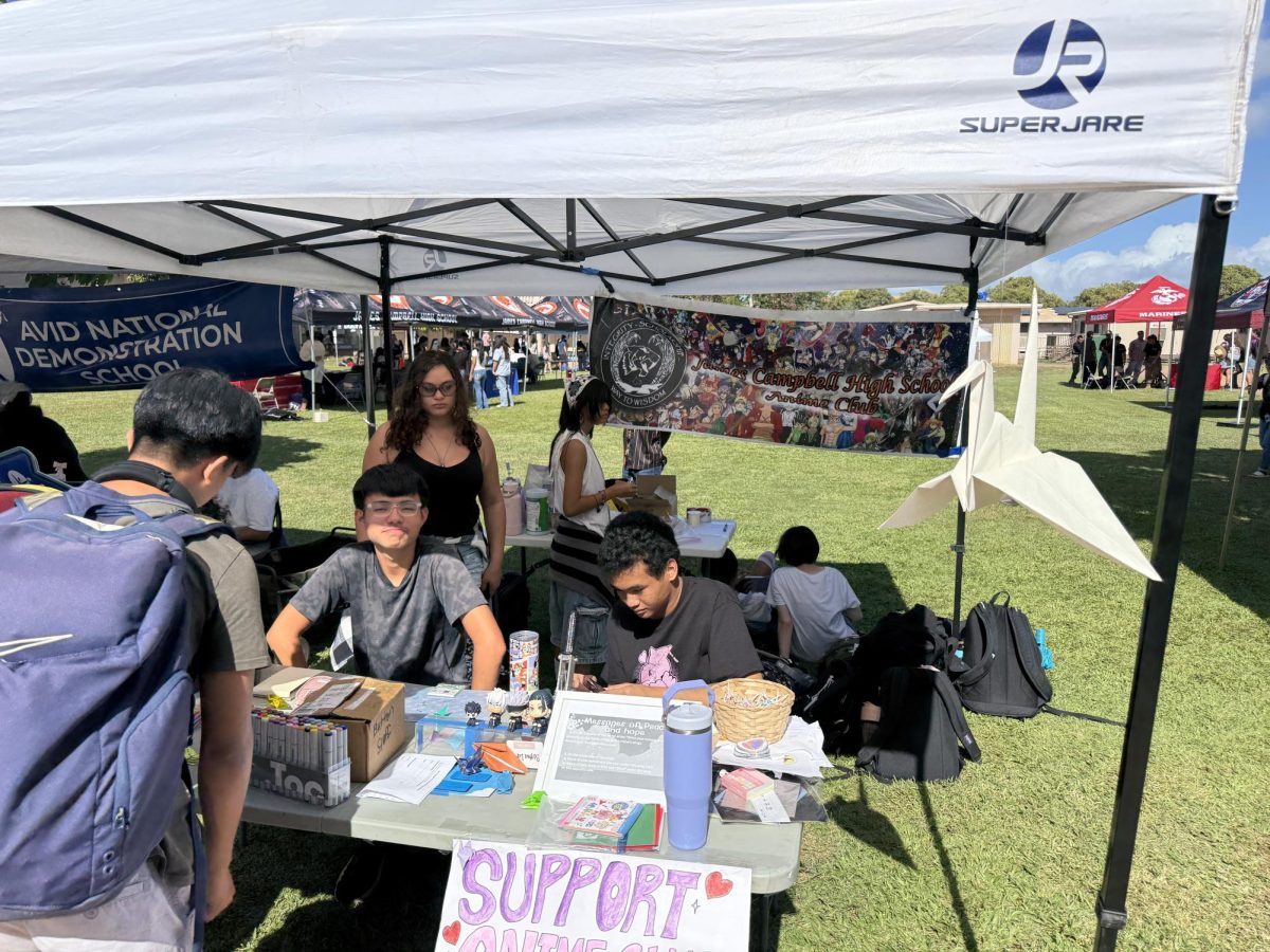 Members of Anime Club working with guests at their booth during Campbell for Causes.